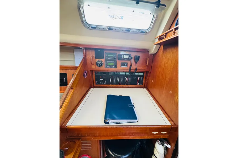 Slide: The Image of Interior of 1989 Hunter Legend 37 sailboat with cozy seating and wooden finishes. - 38
