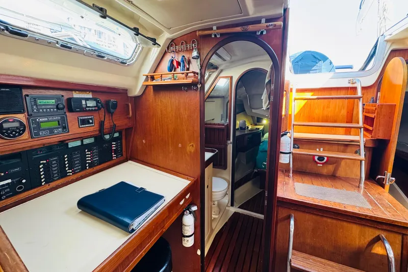 Slide: The Image of Interior of 1989 Hunter Legend 37 sailboat with wood cabinetry and modern amenities. - 39