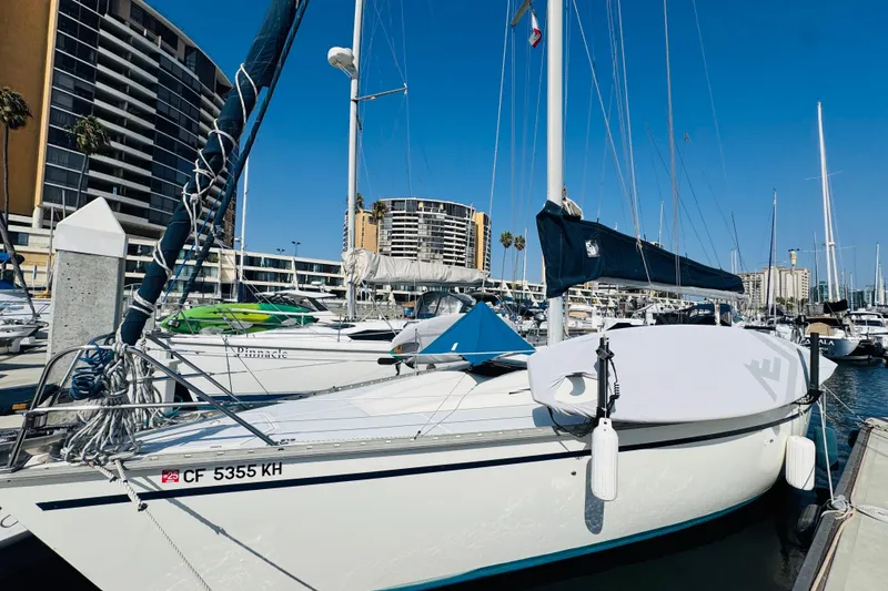 Slide: The Image of 1989 Hunter Legend 37 sailboat docked at marina with clear blue sky. - 4
