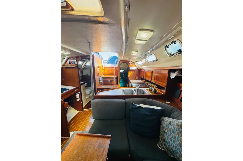Slide: The Image of Interior of 1989 Hunter Legend 37 sailboat with wooden cabinetry and compact kitchen. - 40