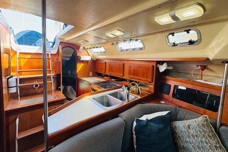 Slide: The Image of Interior of 1989 Hunter Legend 37 sailboat with navigation equipment and wooden cabinetry. - 44