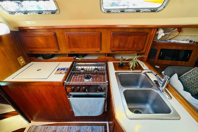 Slide: The Image of Interior of 1989 Hunter Legend 37 sailboat with cozy seating and wooden cabinetry. - 45