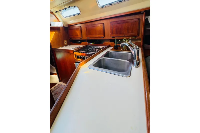 Slide: The Image of Cozy interior of 1989 Hunter Legend 37 sailboat with cushions and wooden cabinetry. - 46