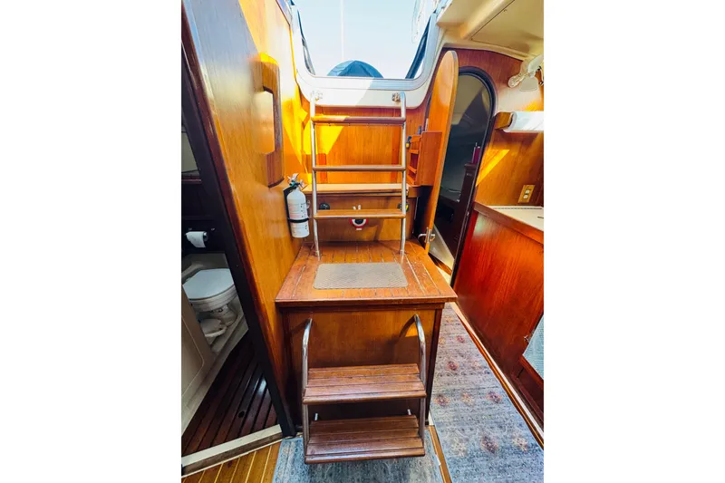 Slide: The Image of Interior of 1989 Hunter Legend 37 yacht with cozy seating and mounted TV. - 47