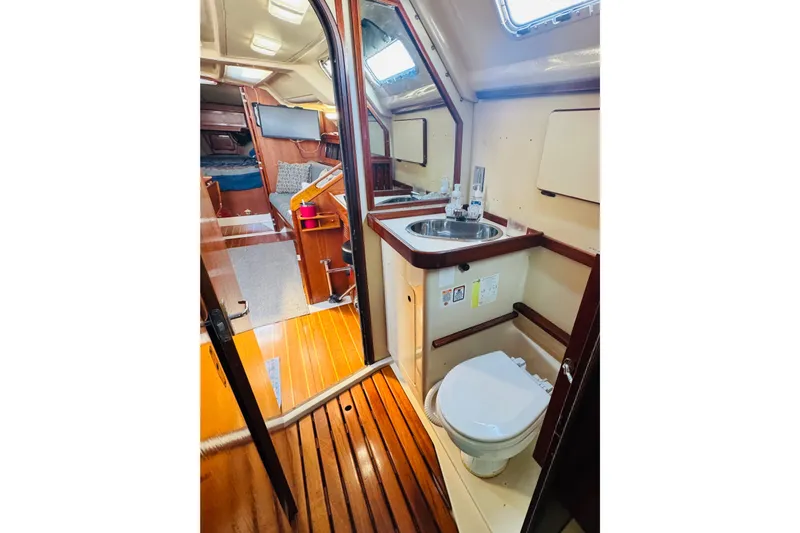 Slide: The Image of Interior of 1989 Hunter Legend 37 sailboat with wooden cabinetry and modern amenities. - 48