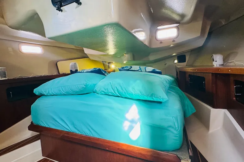 Slide: The Image of Interior of 1989 Hunter Legend 37 sailboat with cozy seating and wooden cabinetry. - 49