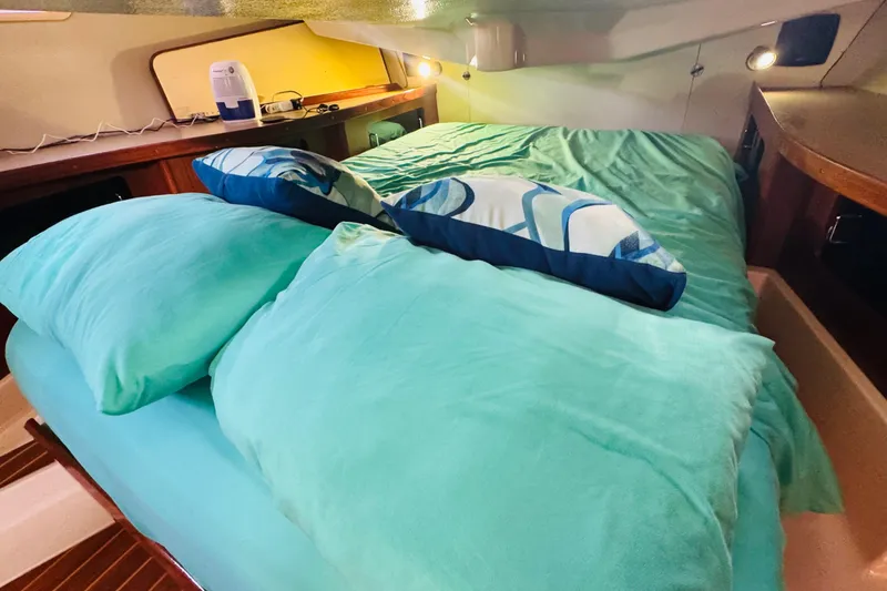 Slide: The Image of 1989 Hunter Legend 37 yacht kitchen with stove, double sink, and wooden cabinetry. - 50