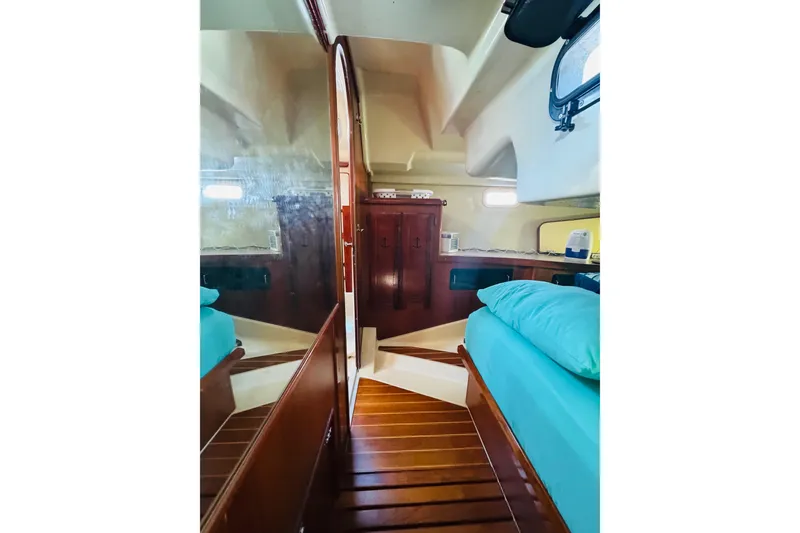 Slide: The Image of 1989 Hunter Legend 37 yacht kitchen with wooden cabinets and dual sink. - 51