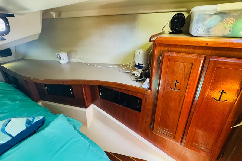 Slide: The Image of Interior of 1989 Hunter Legend 37 sailboat with wooden stairs and cozy cabin. - 52