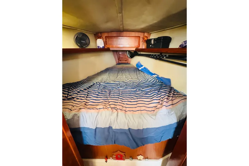 Slide: The Image of Interior of 1989 Hunter Legend 37 sailboat with wooden flooring and cozy cabin. - 56