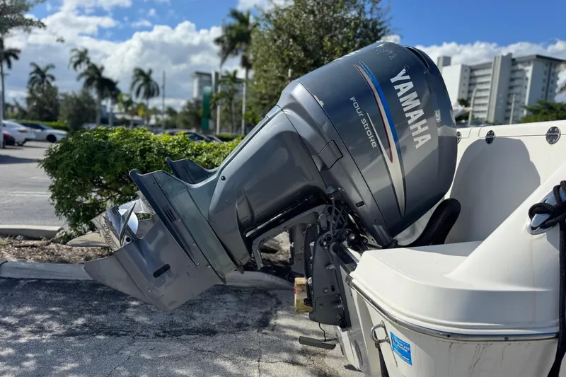 Slide: The Image of 2004 Robalo R260 Center Console boat with Garmin equipment under a clear blue sky. - 11