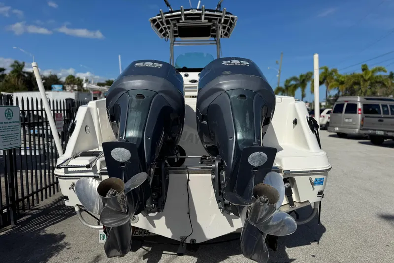 Slide: The Image of 2004 Robalo R260 Center Console boat interior with seating and console details. - 13