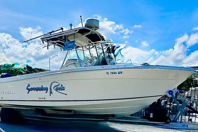 Slide: The Image of 2004 Robalo R260 Center Console boat interior with Yamaha engines visible. - 15