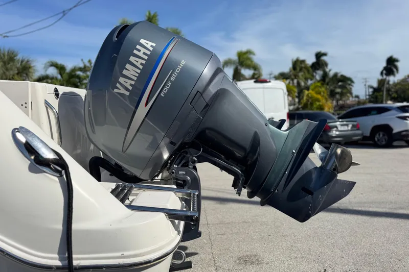 Slide: The Image of 2004 Robalo R260 Center Console boat logo on hull, close-up view. - 16