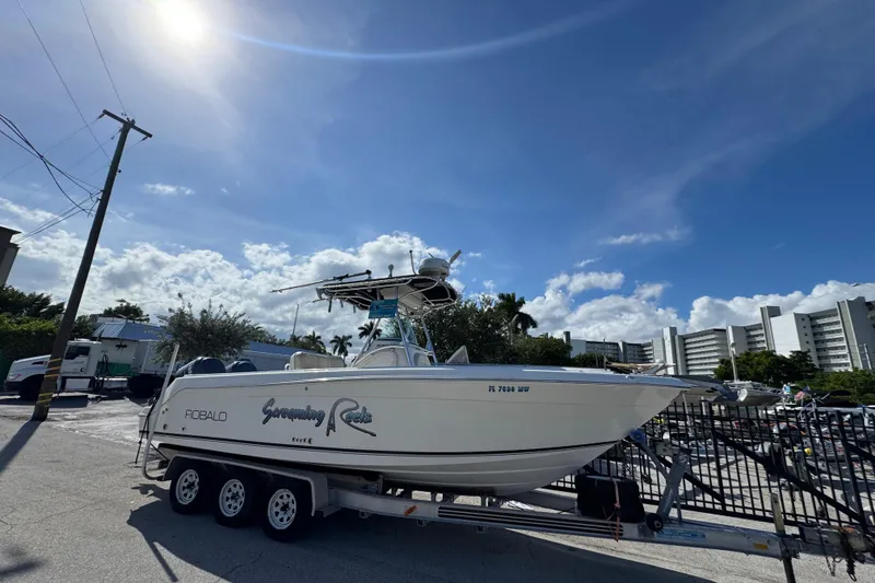 Slide: The Image of Close-up of 2004 Robalo R260 Center Console boat logo and railing. - 28