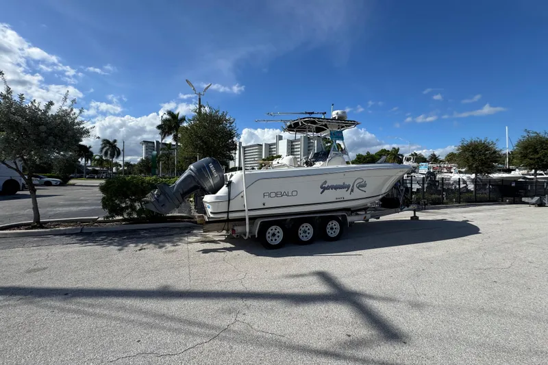 Slide: The Image of 2004 Robalo R260 Center Console boat interior with steering wheel and control panel. - 33