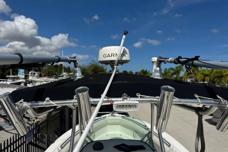 Slide: The Image of 2004 Robalo R260 Center Console boat on trailer in marina setting. - 35