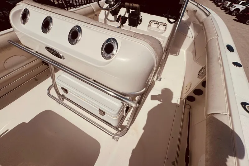 Slide: The Image of Control panel of a 2004 Robalo R260 Center Console boat with labeled switches. - 38