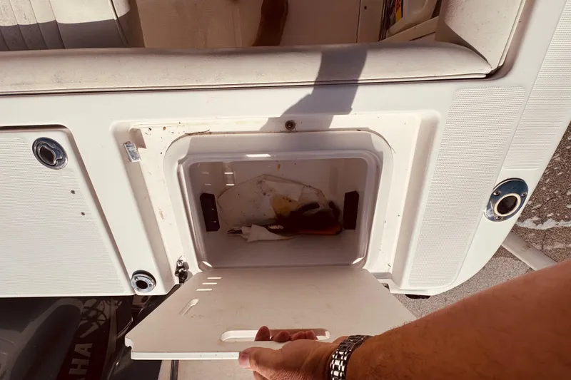 Slide: The Image of Control panel of a 2004 Robalo R260 Center Console boat with Garmin display. - 42