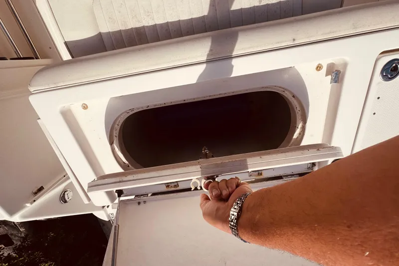 Slide: The Image of Control panel of 2004 Robalo R260 Center Console boat with bow adjustment switches. - 44