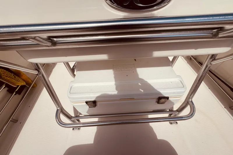 Slide: The Image of 2004 Robalo R260 Center Console dashboard with Garmin navigation and control panel. - 48