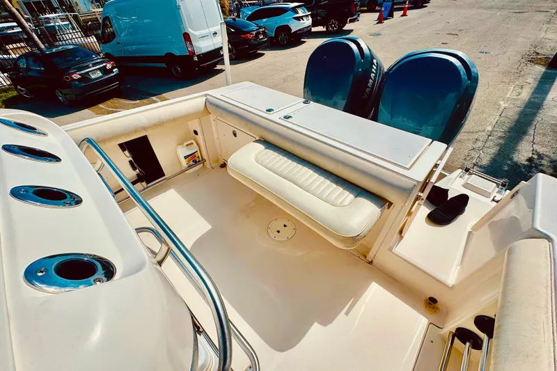Slide: The Image of 2004 Robalo R260 Center Console boat dashboard with navigation and control instruments. - 49