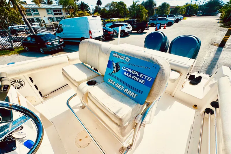 Slide: The Image of 2004 Robalo R260 Center Console with Yamaha outboard motor in a parking lot. - 53