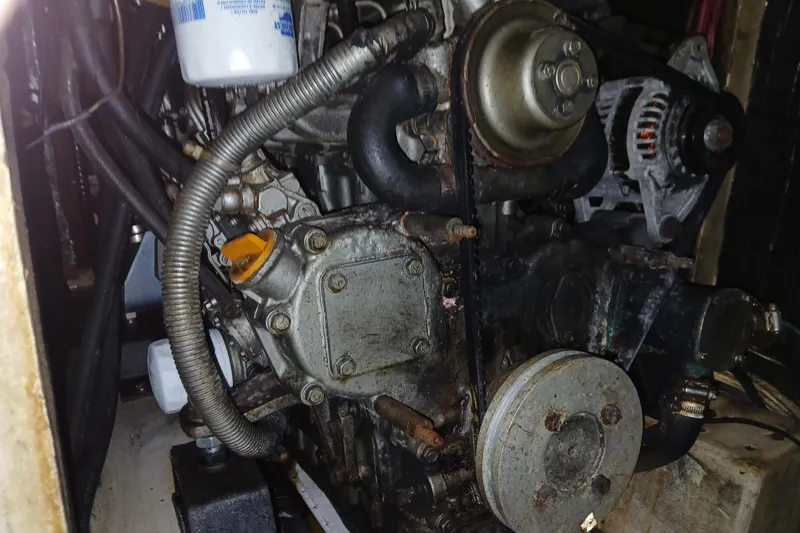 Slide: The Image of 1986 Irwin 43 engine compartment with visible components and wiring. - 22