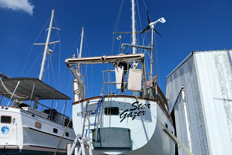 Slide: The Image of 1986 Irwin 43 sailboat "Star Gazer" docked in Key West under clear blue sky. - 25