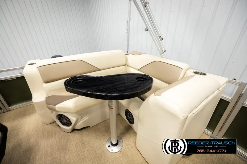 Slide: The Image of Luxurious seating area in 2023 Avalon VEN BF boat with sleek black table. - 20