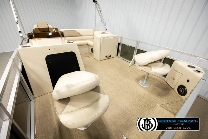 Slide: The Image of 2023 Avalon VEN BF boat interior with beige seating and modern design. - 24