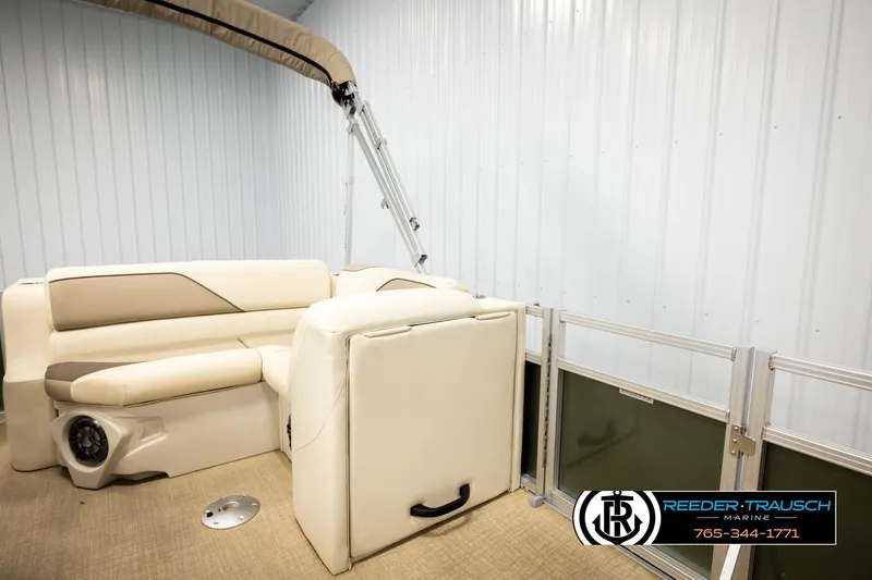 Slide: The Image of 2023 Avalon VEN BF boat interior with beige seating and metal railing. - 26