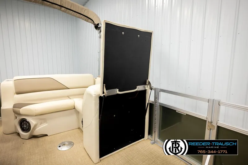Slide: The Image of Interior of 2023 Avalon VEN BF boat with beige seating and privacy enclosure. - 27