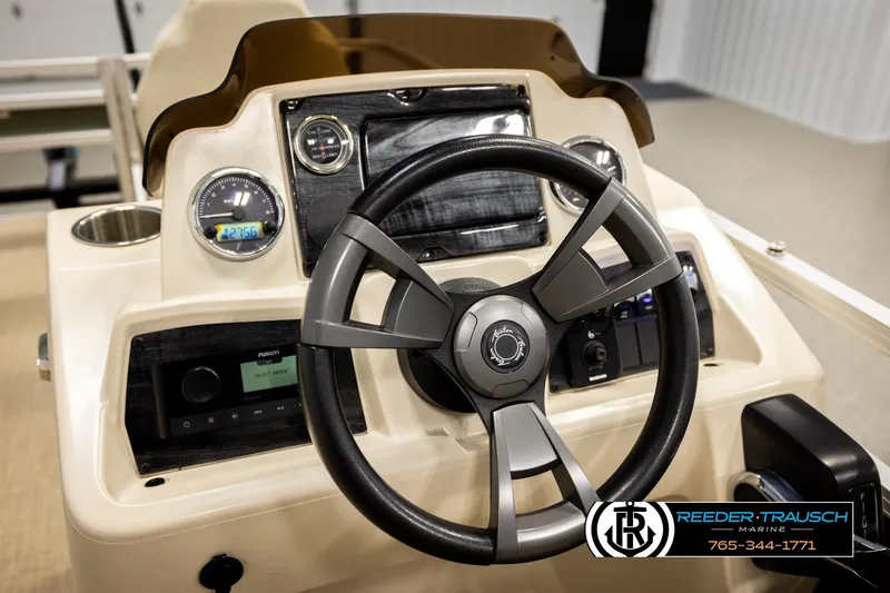 Slide: The Image of Steering console of 2023 Avalon VEN BF boat with modern controls and gauges. - 29