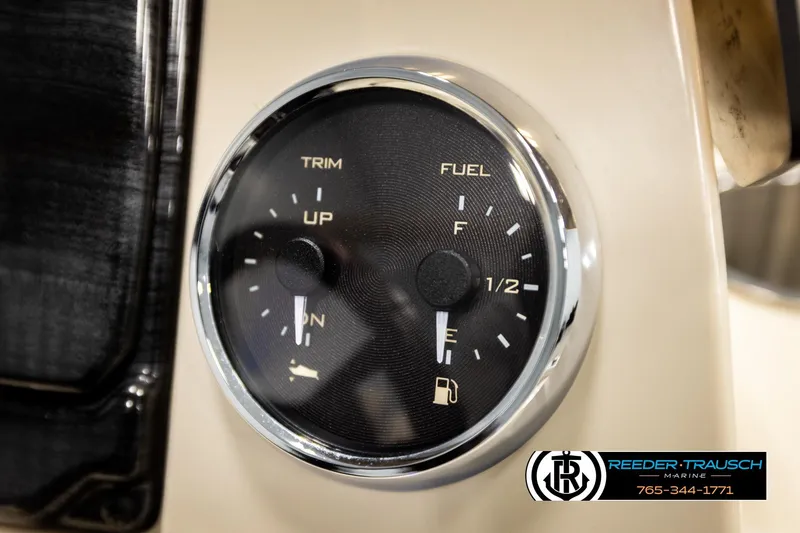 Slide: The Image of Close-up of 2023 Avalon VEN BF fuel and trim gauge, Reeder-Trausch Marine branding visible. - 33