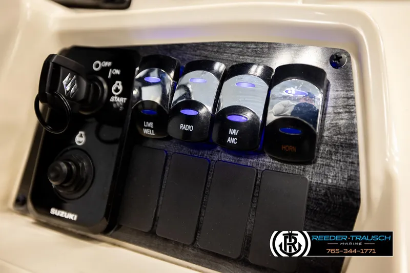 Slide: The Image of Control panel of 2023 Avalon VEN BF boat with switches and Suzuki ignition. - 34