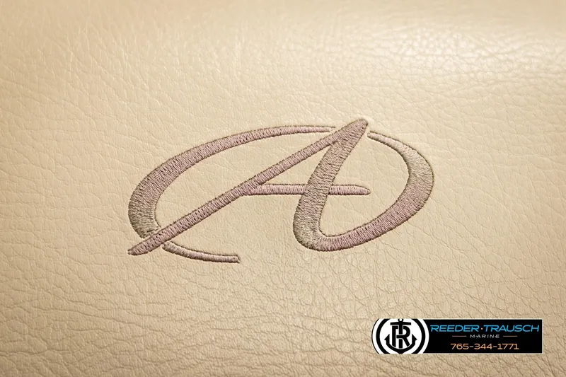 Slide: The Image of 2023 Avalon VEN BF logo on beige leather with Reeder-Trausch Marine contact details. - 39