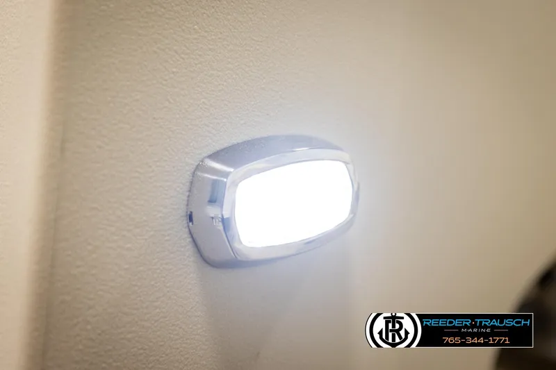 Slide: The Image of LED light on 2023 Avalon VEN BF boat interior, Reeder-Trausch Marine logo visible. - 43