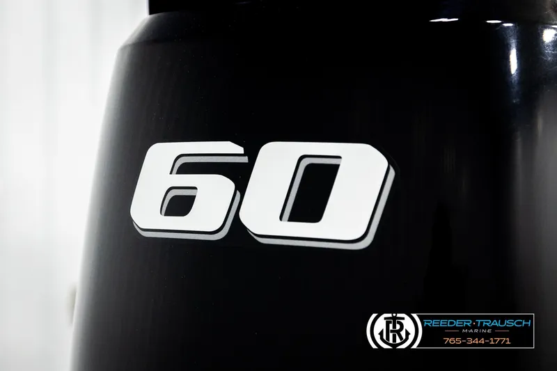 Slide: The Image of Close-up of Avalon VEN BF 2023 engine with '60' decal, Reeder-Trausch Marine logo visible. - 46