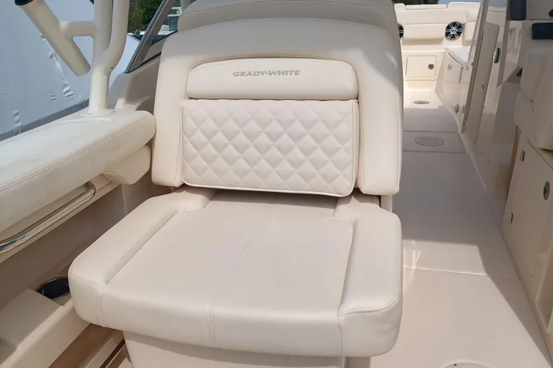 Slide: The Image of 2025 Grady-White Freedom 275 boat seat with luxurious white upholstery. - 11