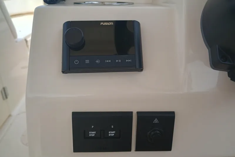 Slide: The Image of Control panel of 2025 Grady-White Freedom 275 boat with Fusion audio system. - 18