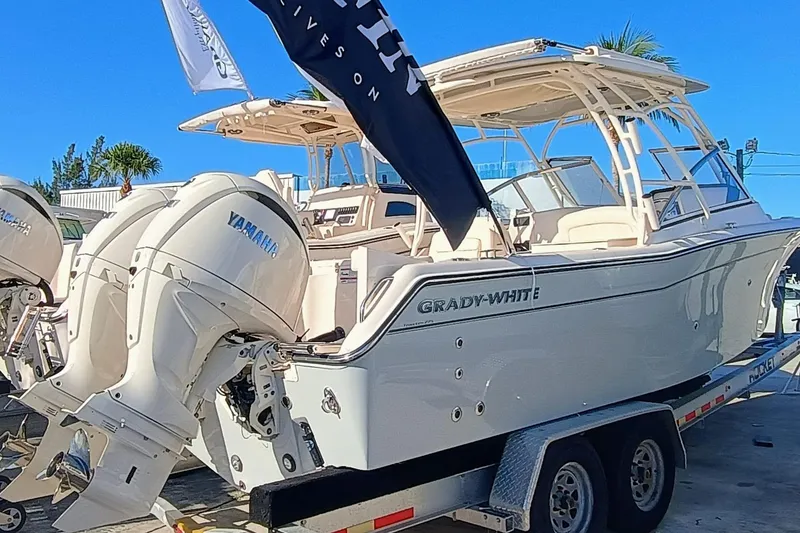 Slide: The Image of 2025 Grady-White Freedom 275 boat on trailer with Yamaha engines. - 3