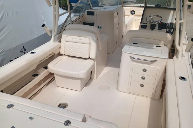 Slide: The Image of 2025 Grady-White Freedom 275 boat interior with seating and storage compartments. - 7