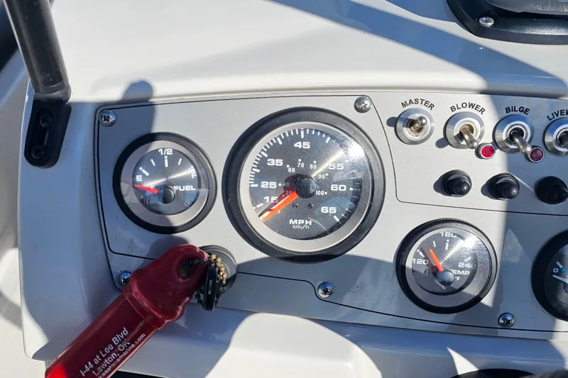 Slide: The Image of Dashboard of a 2016 Tahoe 400 TF boat with gauges and switches. - 11