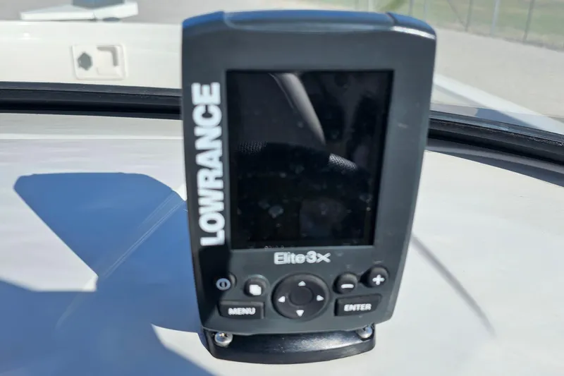Slide: The Image of Lowrance Elite 3X fish finder on 2016 Tahoe 400 TF boat dashboard. - 14