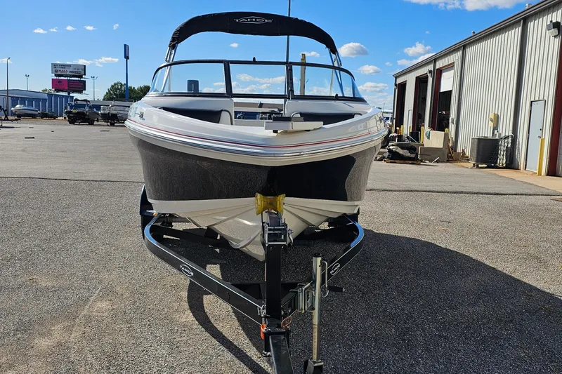Slide: The Image of 2016 Tahoe 400 TF boat on trailer in outdoor dealership lot. - 2