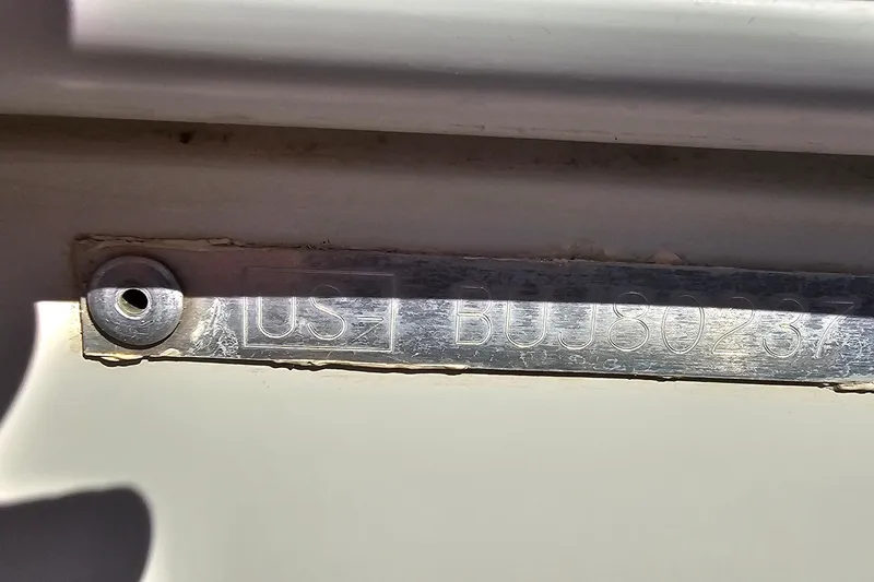Slide: The Image of Close-up of a metal identification plate on a 2016 Tahoe 400 TF boat. - 4