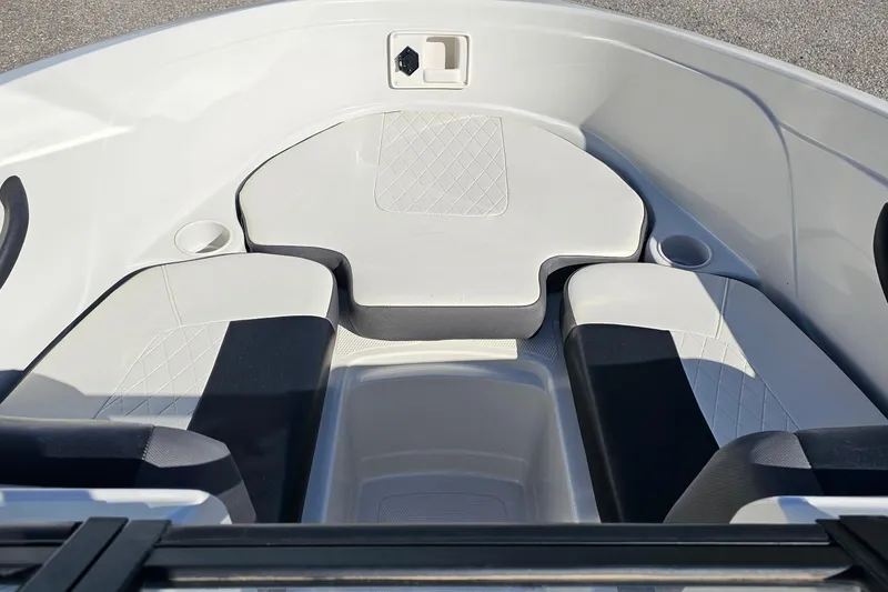 Slide: The Image of 2016 Tahoe 400 TF boat interior with cushioned seating and cup holders. - 5