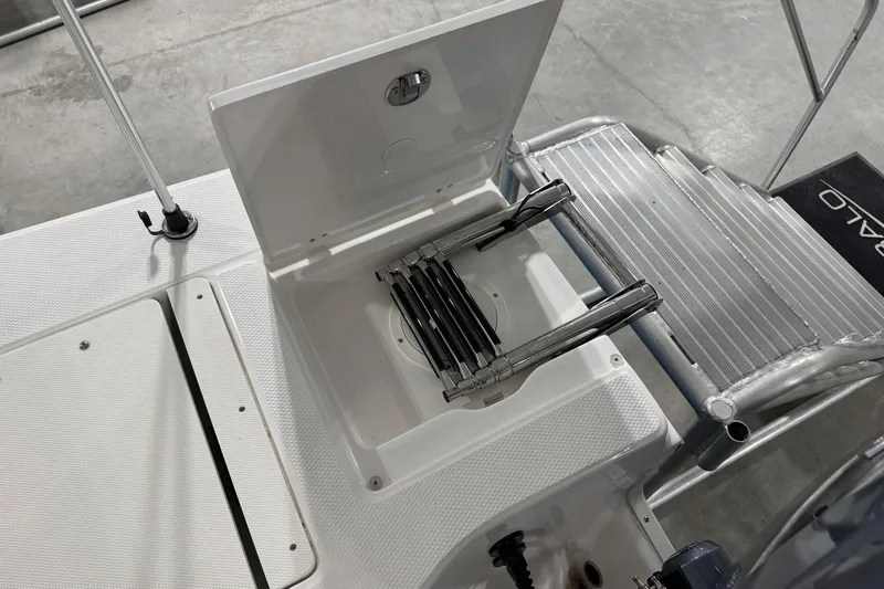 Slide: The Image of 2026 Robalo 206 Cayman boat ladder and storage compartment detail. - 12