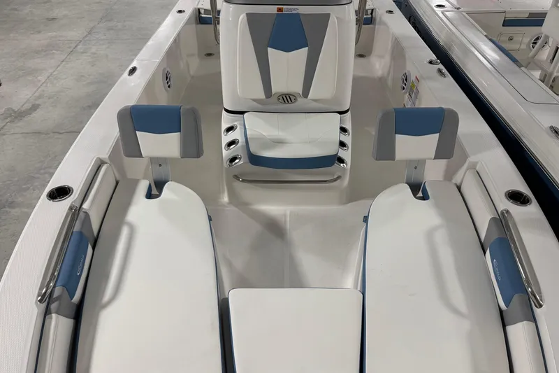 Slide: The Image of 2026 Robalo 206 Cayman boat interior with blue and white seating and modern design. - 14